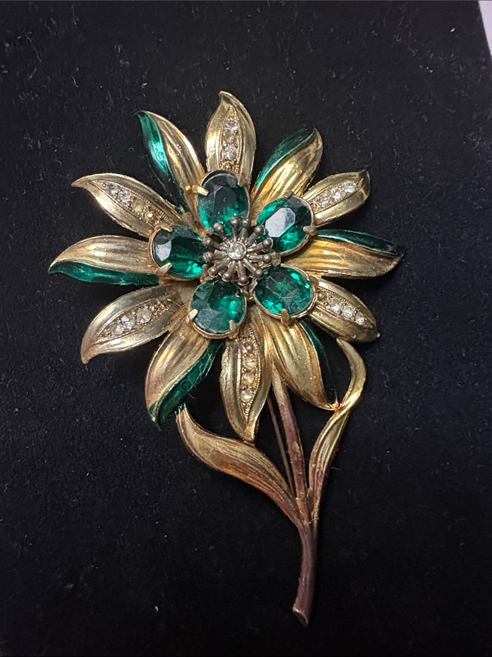 Flowers Brooch with green stone about 4.5 inches long and 3 inches wide.